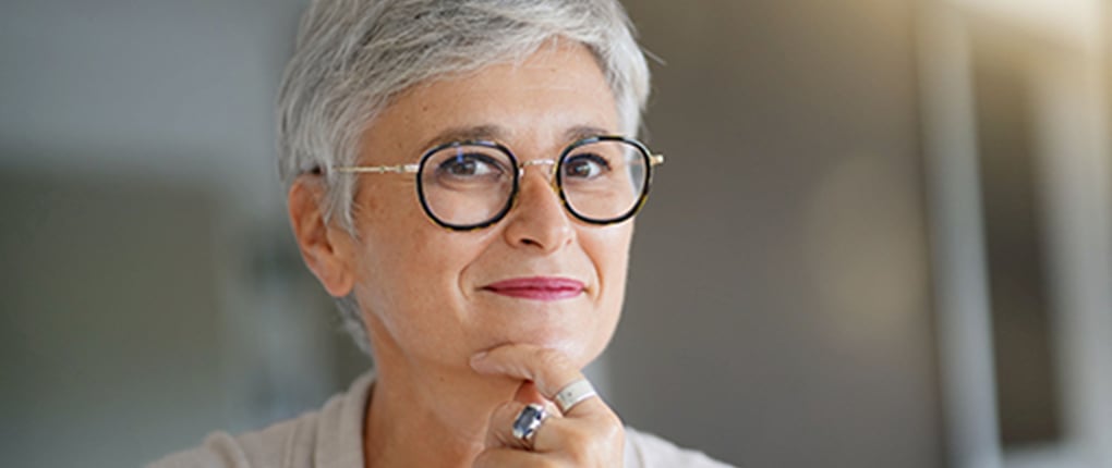 Image of a grey-haired woman smiling