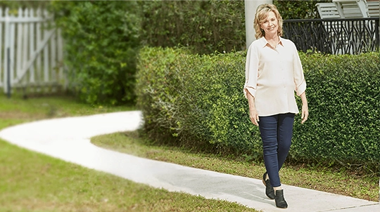 Still from Donna’s story; woman walking on path